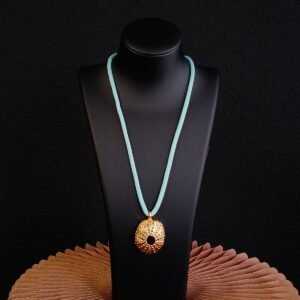 Erizo dorado brillo con cordón en verde agua